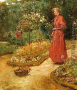 Woman Cutting Roses in a Garden - Frederick Childe Hassam
