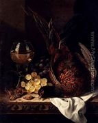 Still Life with a Pheasant, Grapes, Hazelnuts and a Hock Glass on a wooden Ledge - Edward Ladell