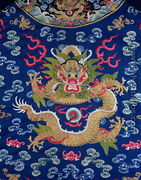 A blue-ground embroidered Kesi dragon robe (detail of dragon) - Chinese School, Qing Dynasty